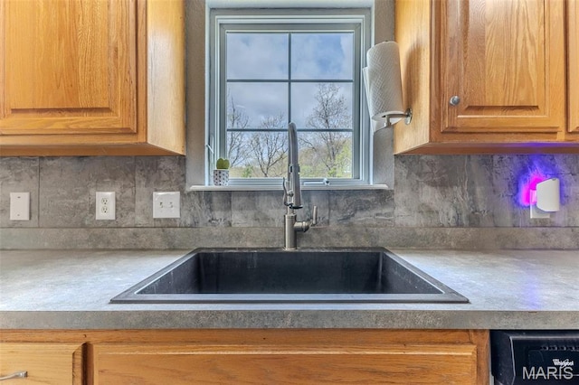 20373 Heritage Rd, Saint Robert, MO 65584 - kitchen featuring a sink, decorative backsplash, and plenty of natural light