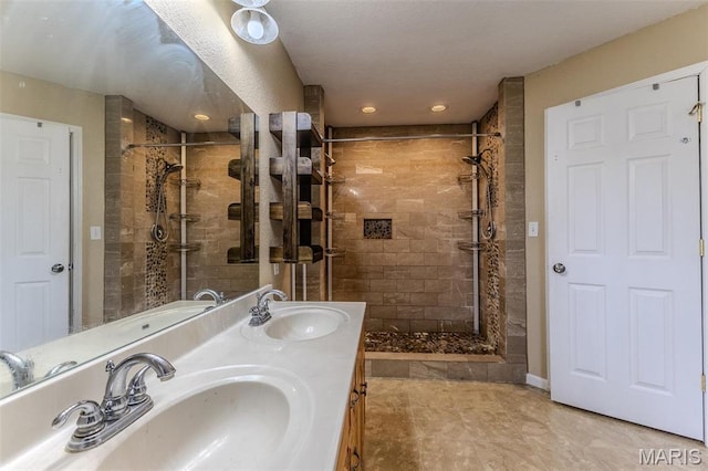 20373 Heritage Rd, Saint Robert, MO 65584 - bathroom featuring tiled shower, double vanity, recessed lighting, and tile patterned floors