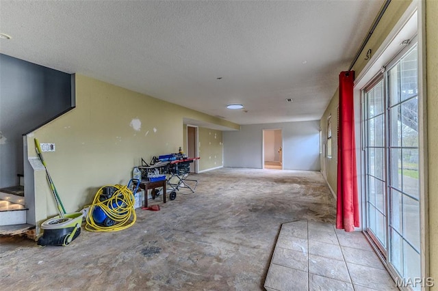 20373 Heritage Rd, Saint Robert, MO 65584 - below grade area with a textured ceiling and plenty of natural light