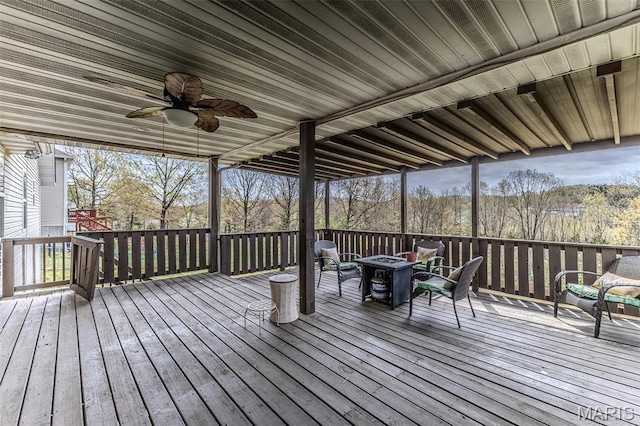 20373 Heritage Rd, Saint Robert, MO 65584 - wooden terrace with a fire pit and ceiling fan