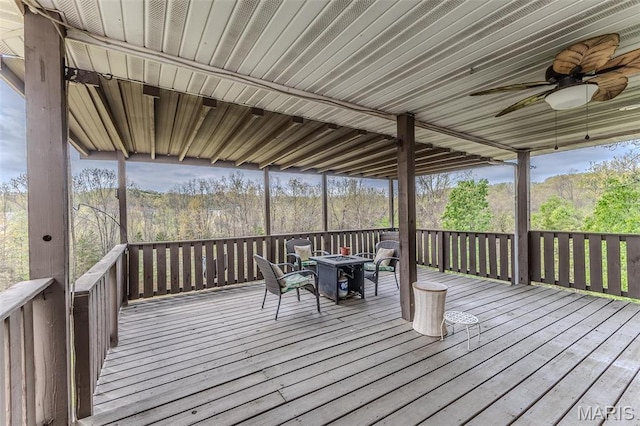 20373 Heritage Rd, Saint Robert, MO 65584 - deck featuring ceiling fan and a fire pit