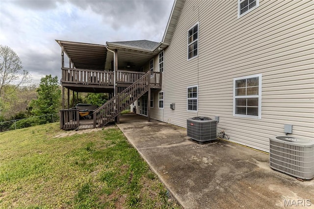 20373 Heritage Rd, Saint Robert, MO 65584 - rear view of property featuring central AC, a patio area, a deck, and stairway