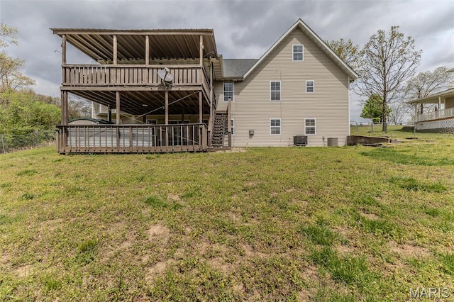 20373 Heritage Rd, Saint Robert, MO 65584 - rear view of property featuring a deck, cooling unit, and stairway