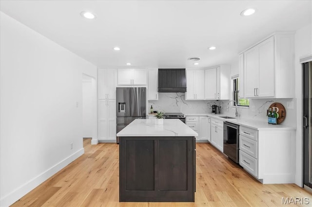 636 Schultz Ct, Foristell, MO 63348 - kitchen featuring stainless steel appliances, a kitchen island, backsplash, white cabinetry, and recessed lighting