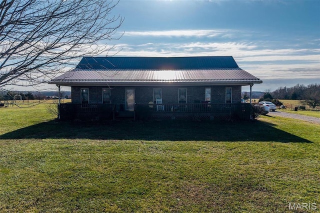 10530 Aspen Rd, Conway, MO 65632 - back of house featuring covered porch, a yard, and metal roof