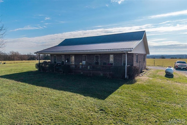 10530 Aspen Rd, Conway, MO 65632 - back of property with a yard, brick siding, and metal roof
