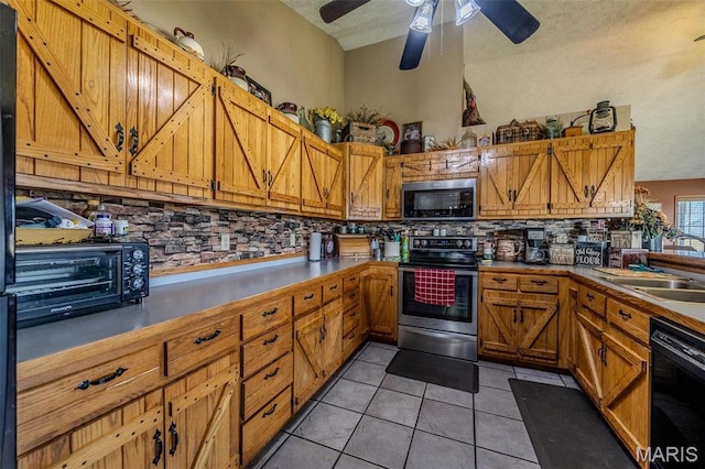 10530 Aspen Rd, Conway, MO 65632 - kitchen with stainless steel appliances, a sink, tasteful backsplash, brown cabinets, and a ceiling fan
