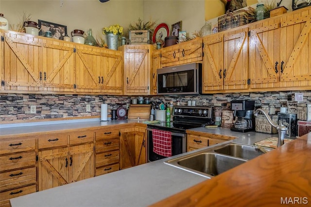 10530 Aspen Rd, Conway, MO 65632 - kitchen with stainless steel appliances, decorative backsplash, light countertops, a sink, and brown cabinetry