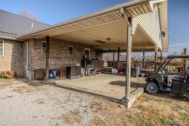 10530 Aspen Rd, Conway, MO 65632 - view of patio featuring an attached carport