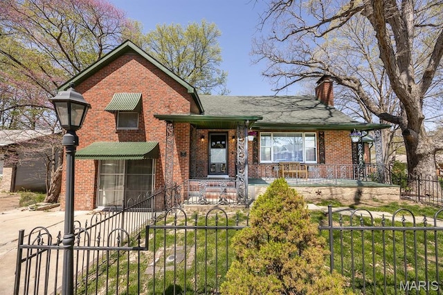 10 Hill Dr, Fairview Heights, IL 62208 - view of front of property with brick siding, a chimney, a fenced front yard, a gate, and covered porch