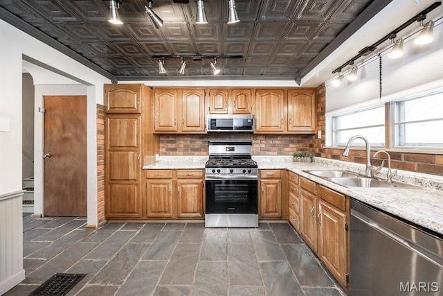 10 Hill Dr, Fairview Heights, IL 62208 - kitchen featuring rail lighting, appliances with stainless steel finishes, a sink, an ornate ceiling, and light countertops