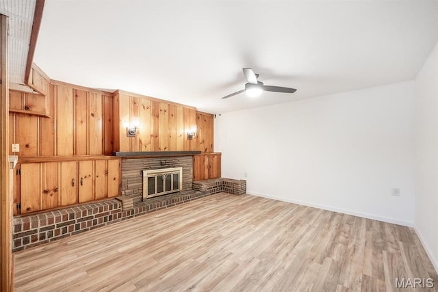 10 Hill Dr, Fairview Heights, IL 62208 - unfurnished living room with a ceiling fan, light wood finished floors, a fireplace, and baseboards