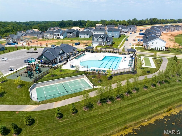 aerial view of residential area featuring a pool area