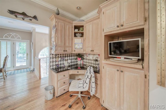kitchen with crown molding, light wood finished floors, light brown cabinetry, dark countertops, and open shelves