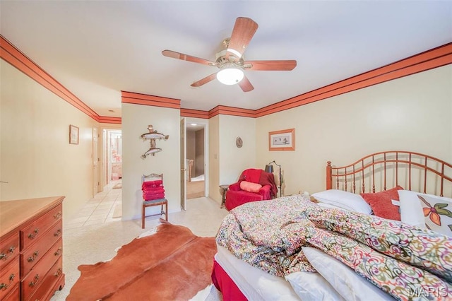 bedroom featuring crown molding, a ceiling fan, and light colored carpet
