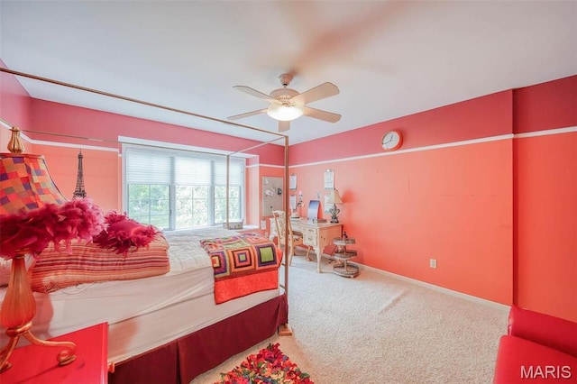 carpeted bedroom featuring baseboards and ceiling fan