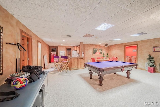 recreation room featuring light carpet, billiards, a drop ceiling, ceiling fan, and baseboards
