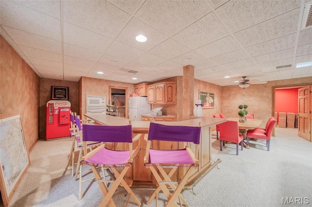 dining space featuring light colored carpet, a paneled ceiling, ceiling fan, and recessed lighting