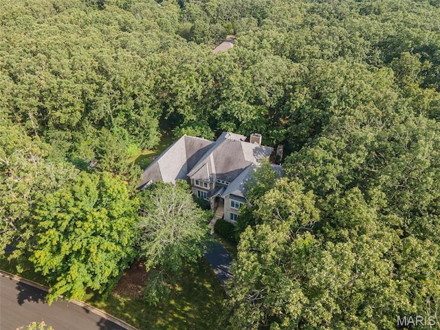 aerial overview of property's location with a forest