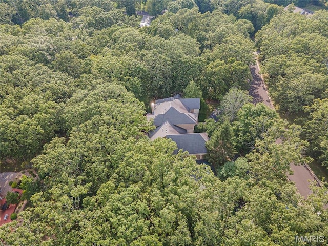 aerial overview of property's location featuring a heavily wooded area