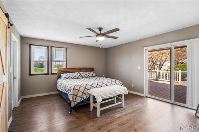 6639 Gladel Dr, Waterloo, IL 62298 - bedroom with access to outside, wood finished floors, a ceiling fan, and a barn door