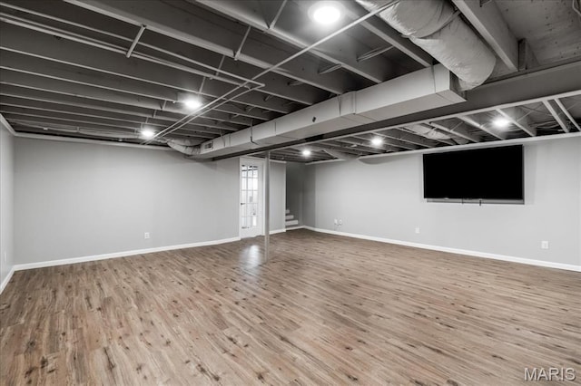 6639 Gladel Dr, Waterloo, IL 62298 - below grade area with wood finished floors and baseboards