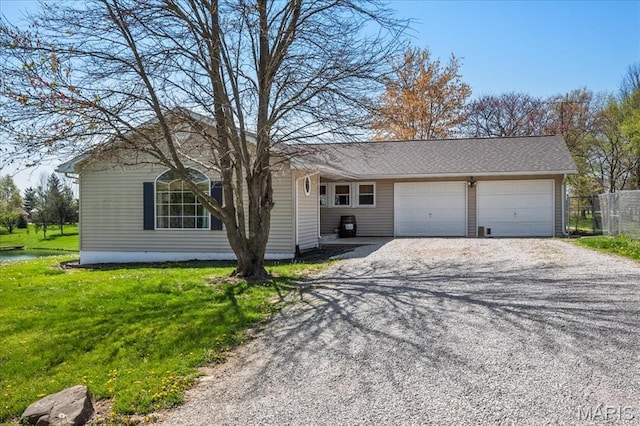 6639 Gladel Dr, Waterloo, IL 62298 - ranch-style house featuring gravel driveway and a garage