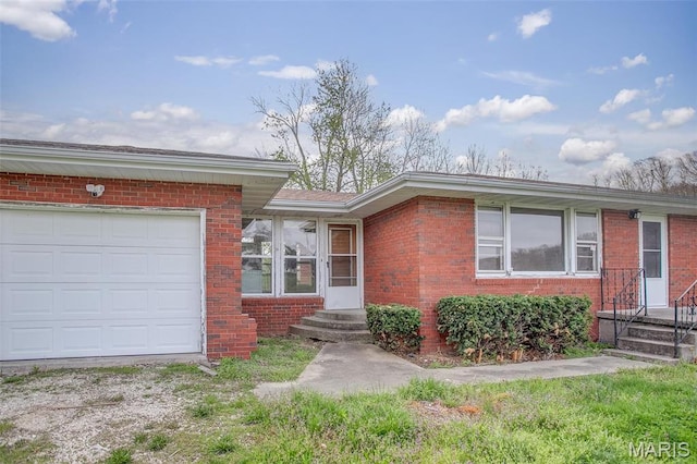 1219 N Park St, Hardin, IL 62047 - view of front of property featuring brick siding and a garage