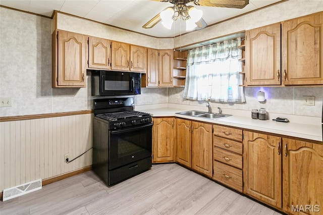 1219 N Park St, Hardin, IL 62047 - kitchen featuring black appliances, open shelves, light wood finished floors, a sink, and ceiling fan