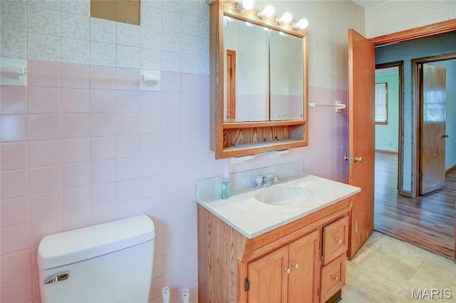 1219 N Park St, Hardin, IL 62047 - bathroom featuring tile walls, vanity, and toilet