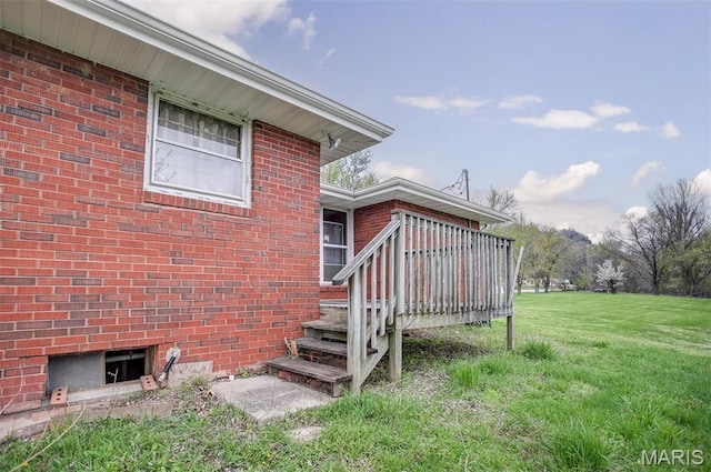1219 N Park St, Hardin, IL 62047 - view of side of home with a wooden deck, a lawn, and brick siding