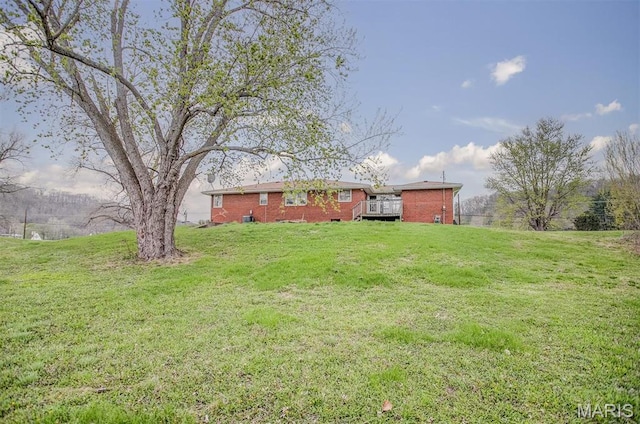 1219 N Park St, Hardin, IL 62047 - view of green lawn with a wooden deck
