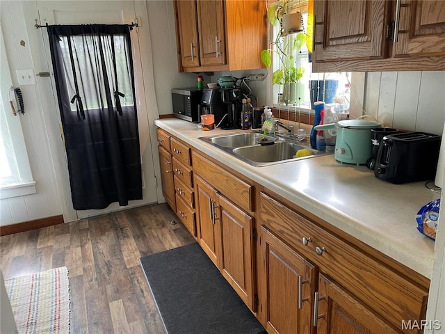 101 County Road 5170, Salem, MO 65560 - kitchen featuring a sink, brown cabinetry, light countertops, and dark wood finished floors