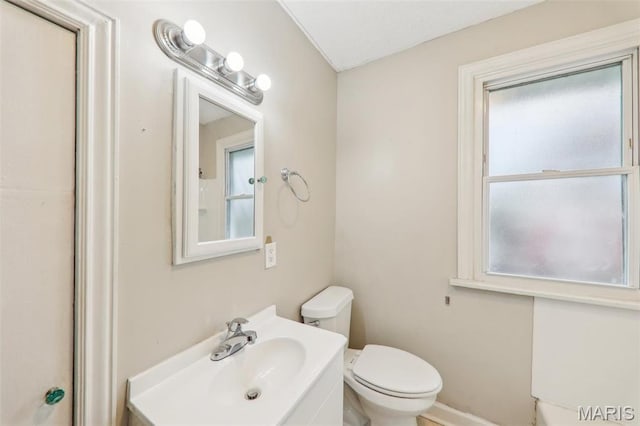 241 Dammert Ave, Saint Louis, MO 63125 - bathroom featuring plenty of natural light, toilet, and vanity