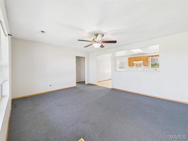 710 W Jefferson Ave, Conway, MO 65632 - unfurnished room with ceiling fan, baseboards, and light colored carpet