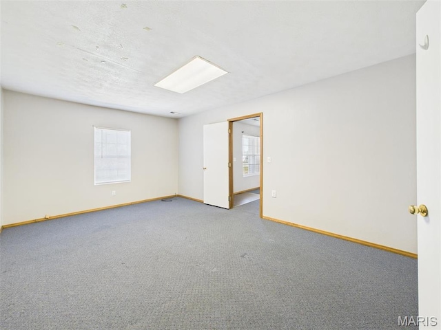 710 W Jefferson Ave, Conway, MO 65632 - spare room featuring baseboards and carpet floors