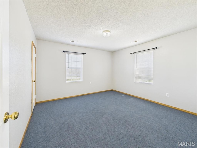 710 W Jefferson Ave, Conway, MO 65632 - carpeted empty room featuring baseboards and a textured ceiling