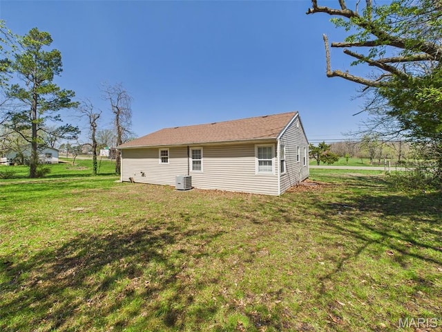 710 W Jefferson Ave, Conway, MO 65632 - back of house with central AC and a lawn