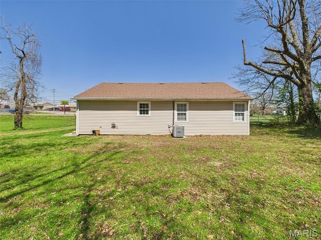 710 W Jefferson Ave, Conway, MO 65632 - rear view of property featuring a yard and central AC unit