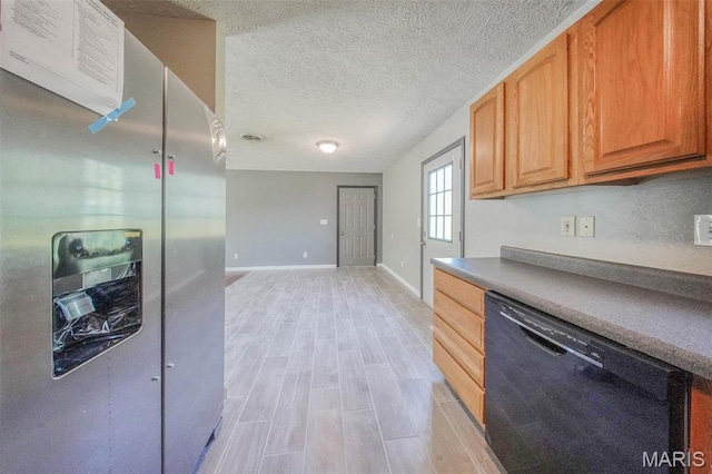 kitchen with dishwasher, stainless steel fridge, baseboards, light wood-style floors, and a textured ceiling