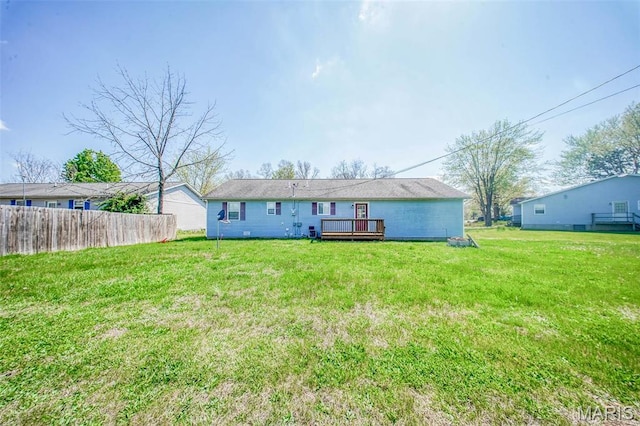 back of property with a deck
