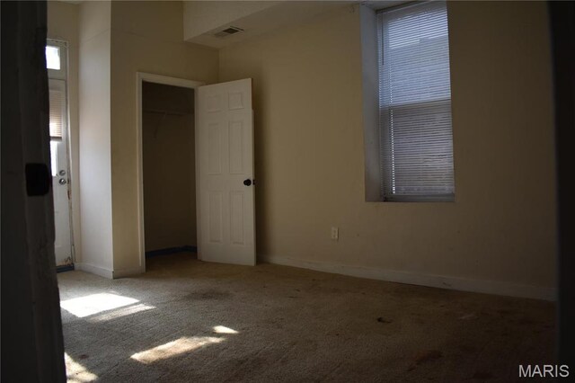 2912 Indiana Ave, Saint Louis, MO 63118 - unfurnished bedroom with carpet flooring, baseboards, and a closet