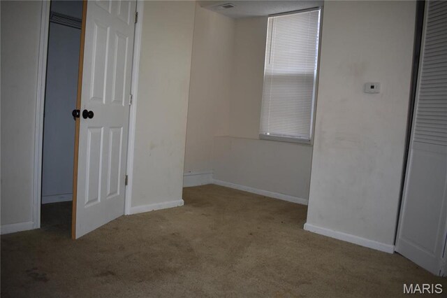 2912 Indiana Ave, Saint Louis, MO 63118 - unfurnished bedroom with carpet and baseboards