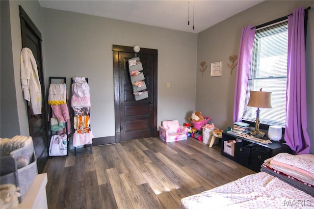 bedroom with wood finished floors