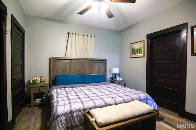 bedroom with wood finished floors and a ceiling fan