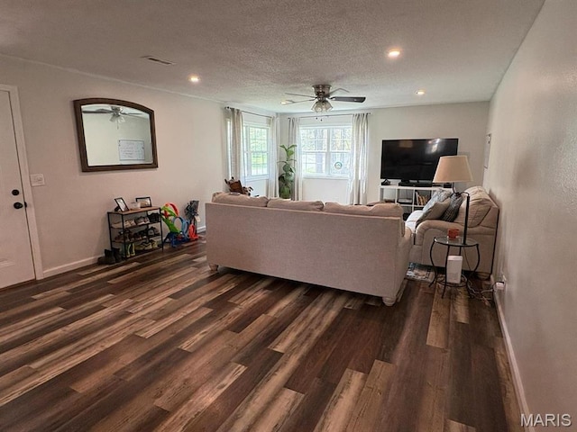 10817 Cabin Ln, Dexter, MO 63841 - living room featuring dark wood-style floors, ceiling fan, baseboards, recessed lighting, and a textured ceiling