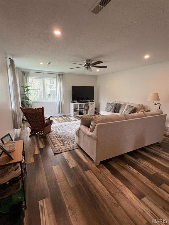 10817 Cabin Ln, Dexter, MO 63841 - living room featuring dark wood-style flooring, a textured ceiling, recessed lighting, and ceiling fan