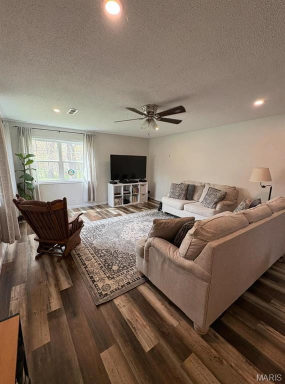 10817 Cabin Ln, Dexter, MO 63841 - living room with a textured ceiling, dark wood-type flooring, ceiling fan, and recessed lighting