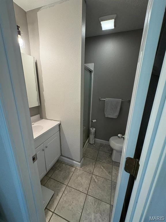 10817 Cabin Ln, Dexter, MO 63841 - full bath with toilet, a shower stall, vanity, and baseboards