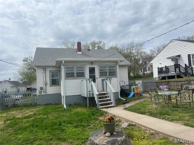 1714 Price St, Hannibal, MO 63401 - rear view of house with a chimney and a shingled roof